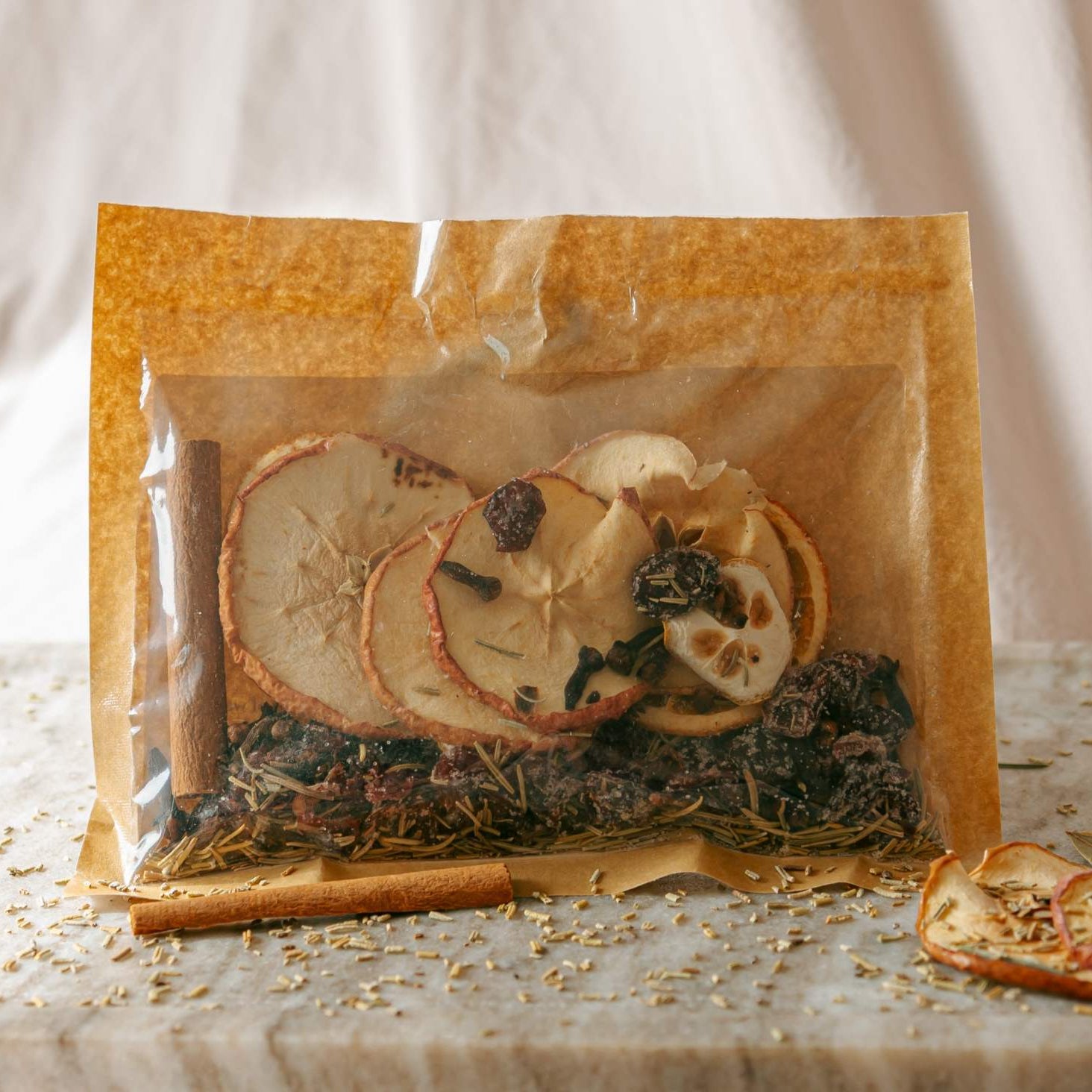 Packaged dried fruit mix with visible ingredients on a textured surface