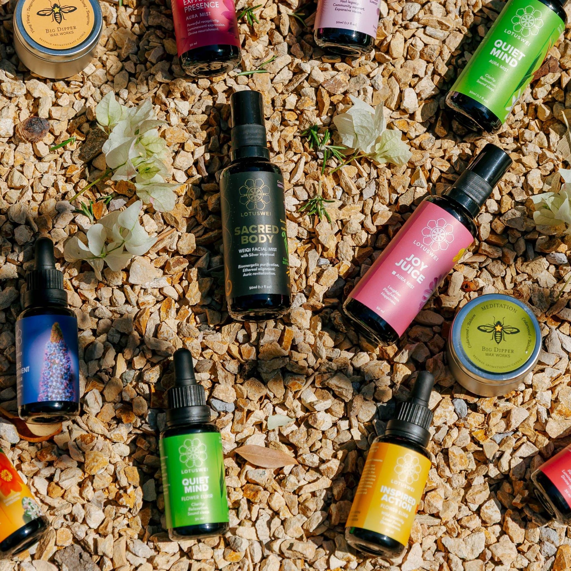 Various flower essences on a textured surface with flowers