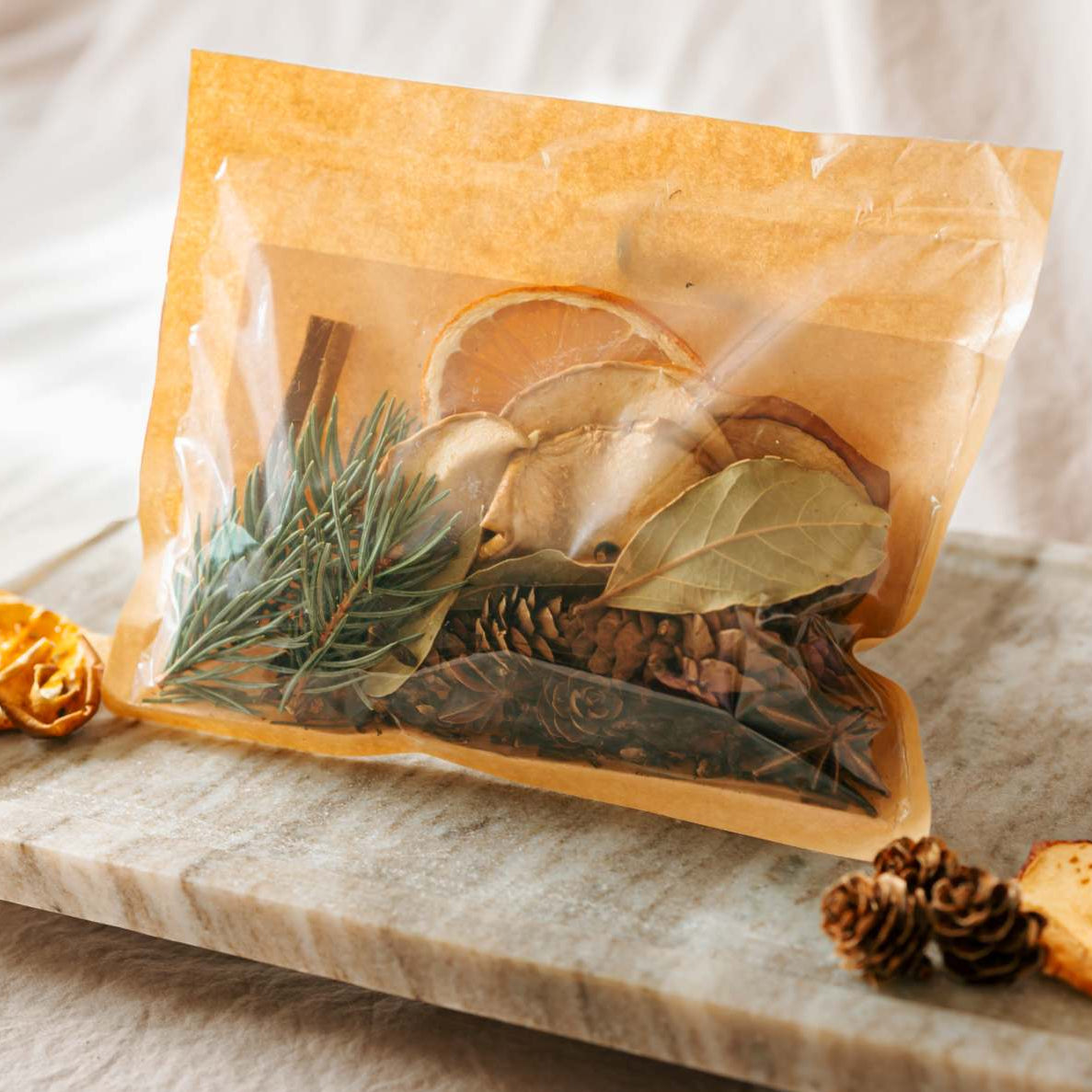 Herbal package with dried herbs on a marble tray